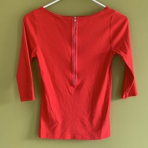 Ann Taylor poppy red jersey top with gold tone back zip and 3/4 sleeves.